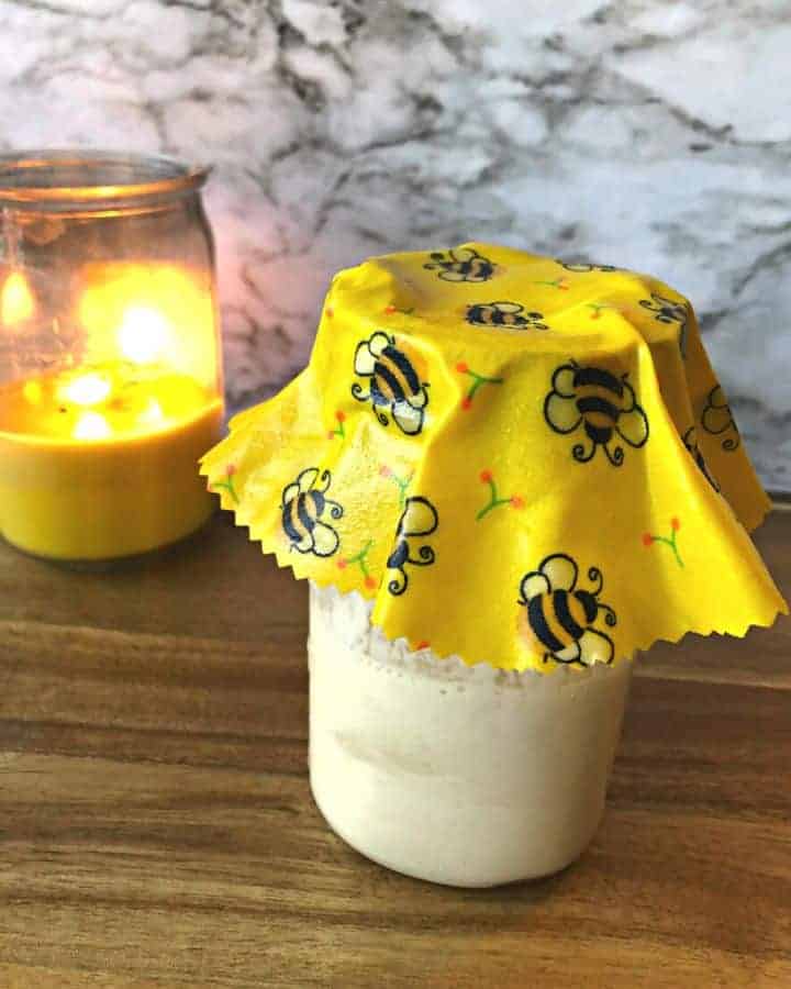 beeswax wrap covering jar of sourdough starter instead of plastic wrap
