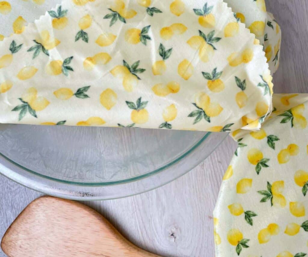 yellow beeswax wraps on glass bowls