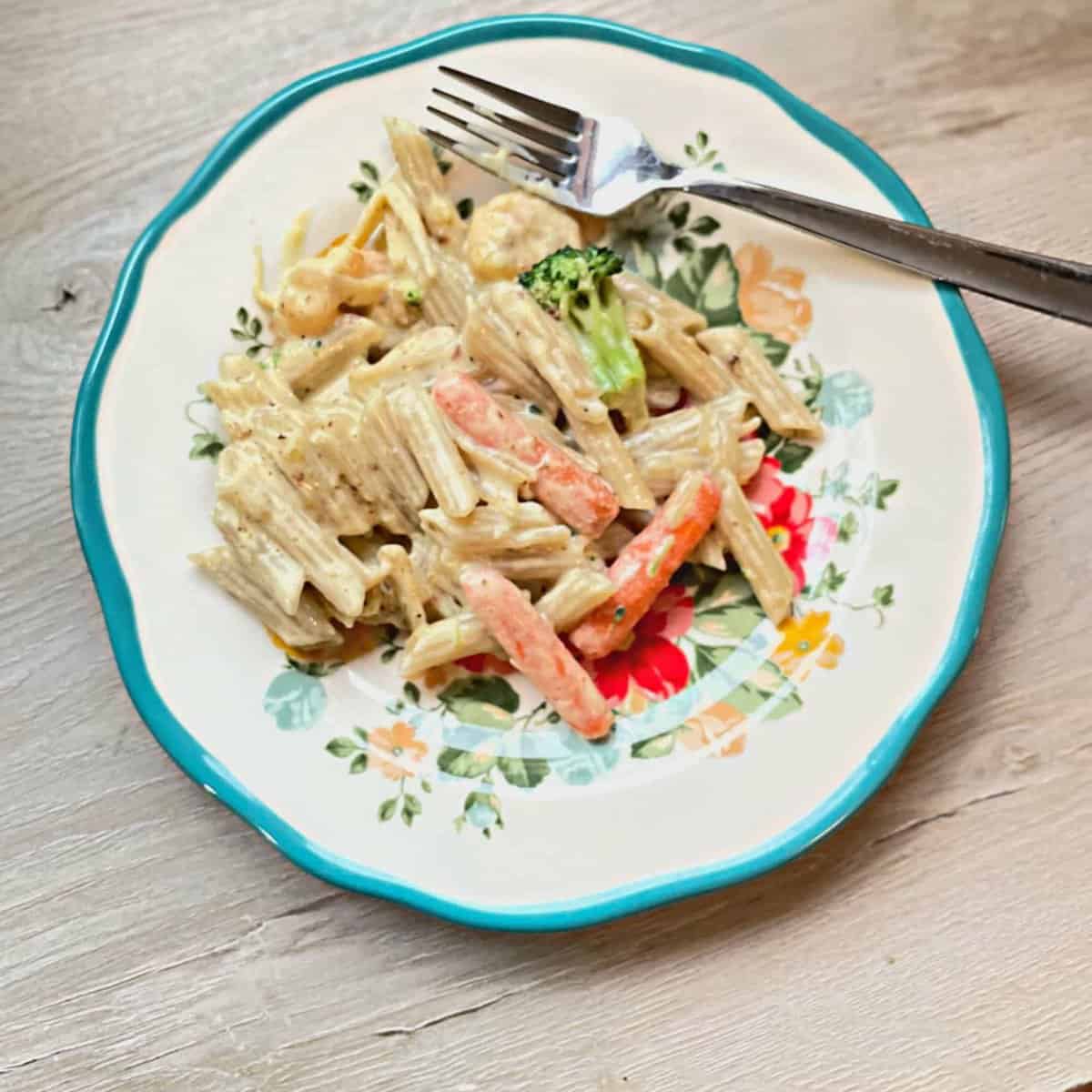 gluten free shrimp Alfredo on plate with fork