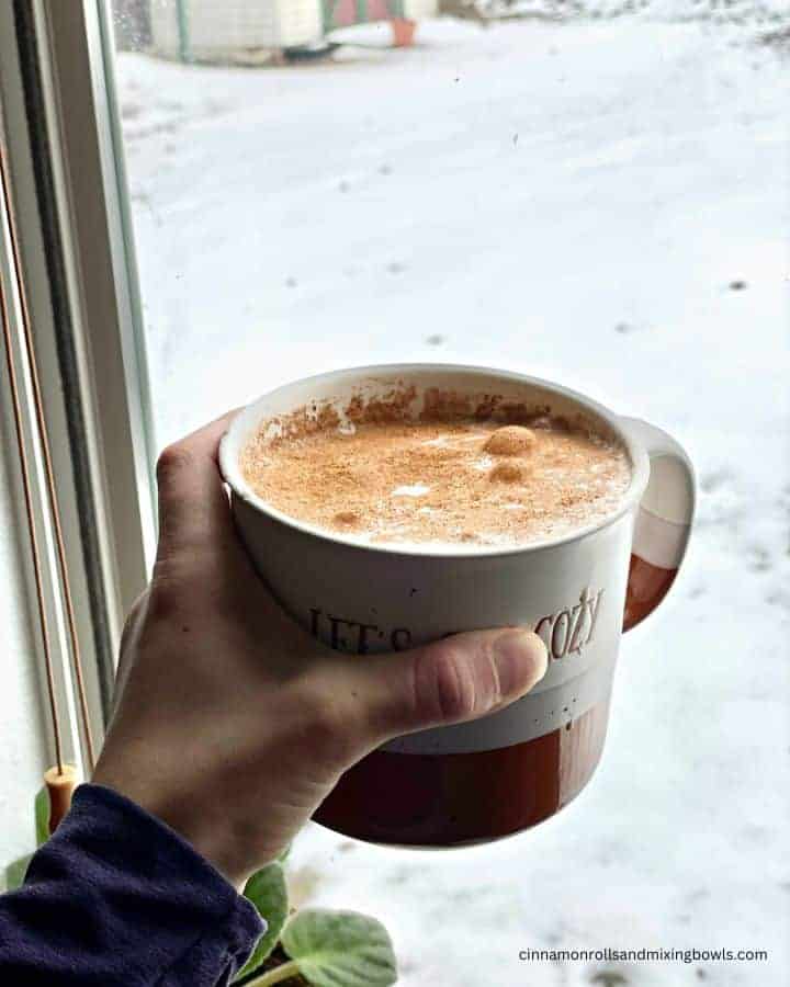 hazelnut latte held in window