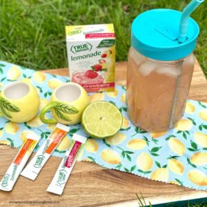 feature image Easy summer drink (that is healthy for you!) drink outside with lime pieces and drink mixes