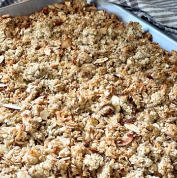 homemade crunchy coconut almond granola cooling in pan