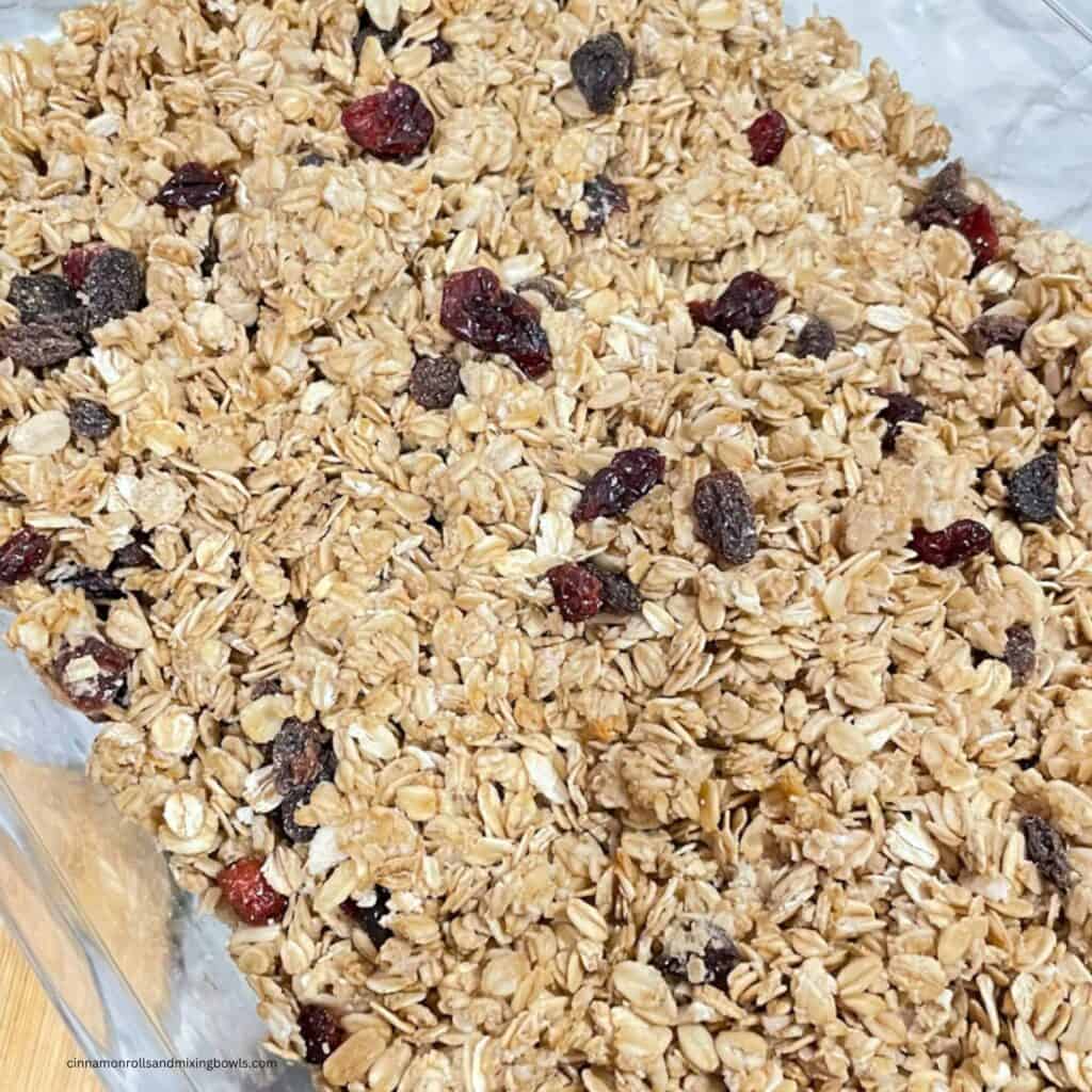 feature image of homemade crunchy maple cinnamon granola in pan all baked