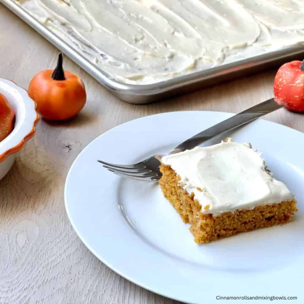 kamut pumpkin bars with cream cheese frosting served on white plate