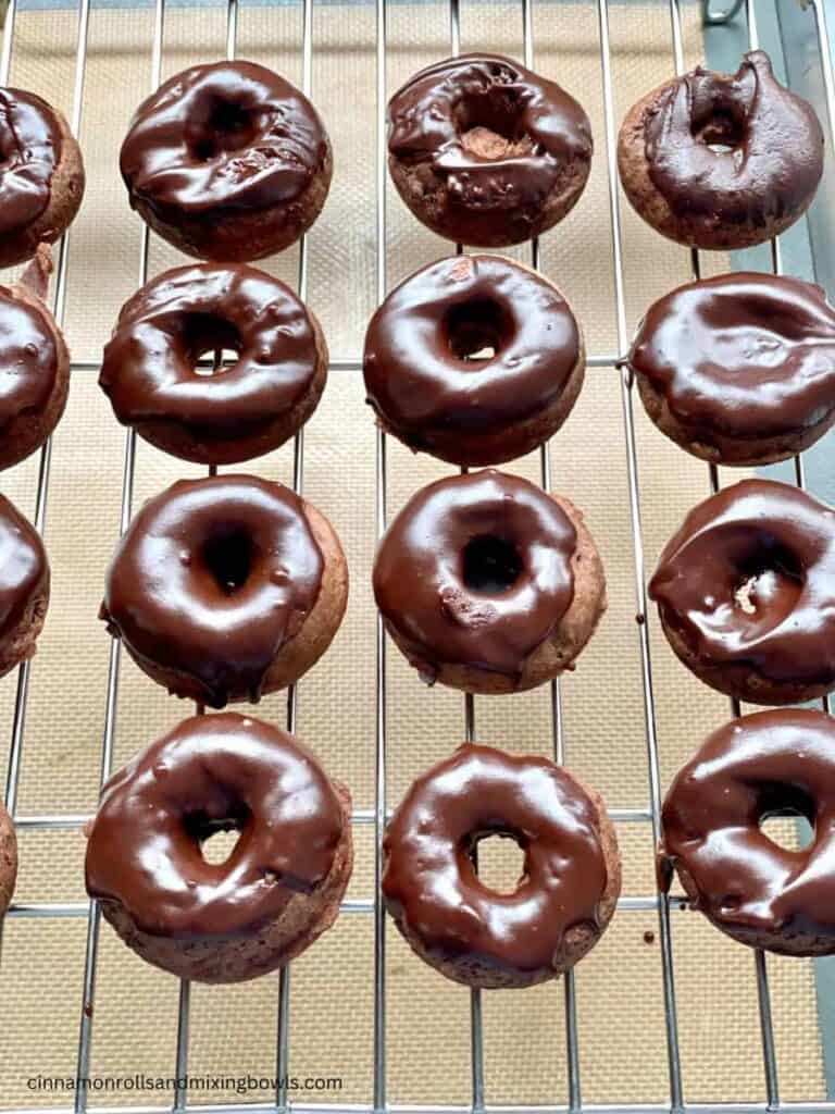 Kamut chocolate cake donuts frosted on cooling rack