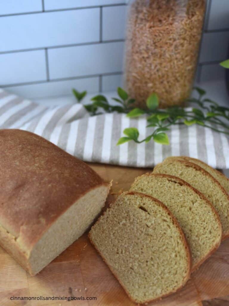 Freshly milled kamut bread baked and sliced on counter