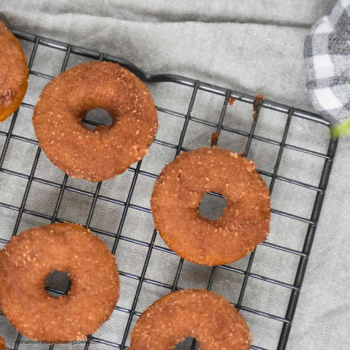 Kamut pumpkin cake donuts baked on cooling rack